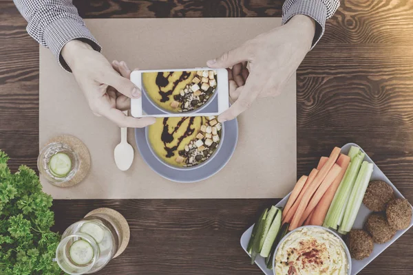 Blogger taking picture of soup — Stock Photo, Image