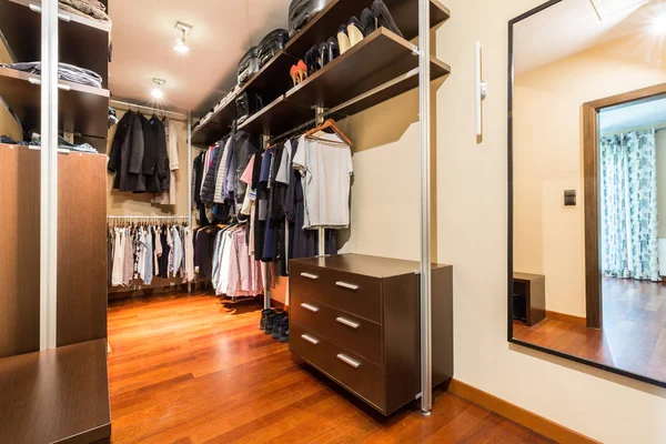 Walk-in closet with wooden wardrobes — Stock Photo, Image