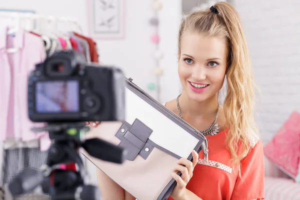 Girl posing with woman's bag — Stock Photo, Image