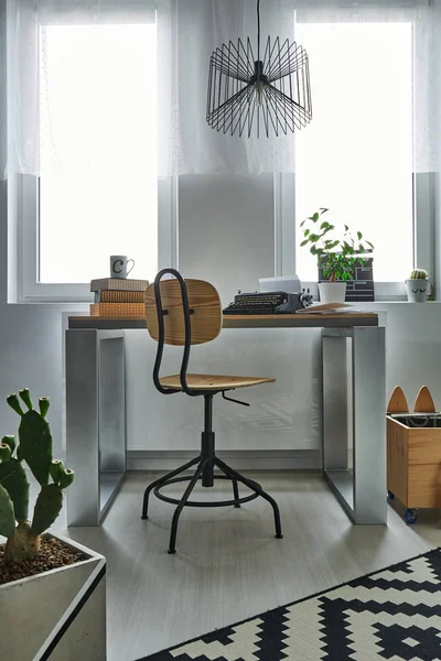 Simple desk and wooden chair — Stock Photo, Image