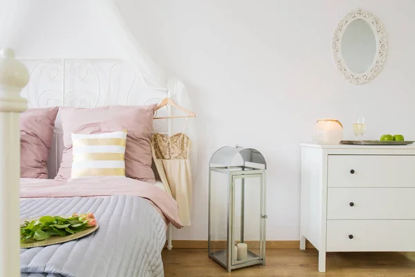 Bed, dresser and decorative lantern — Stock Photo, Image