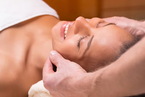 Beautiful woman having face massage