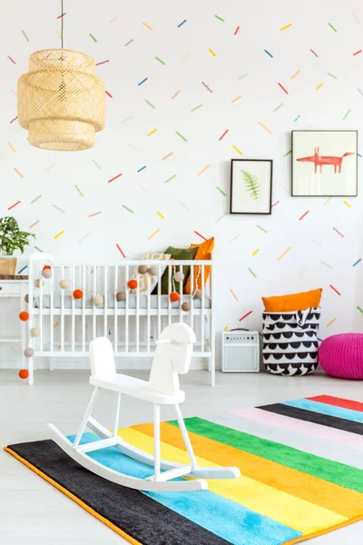 Baby room with rocking horse — Stok Foto