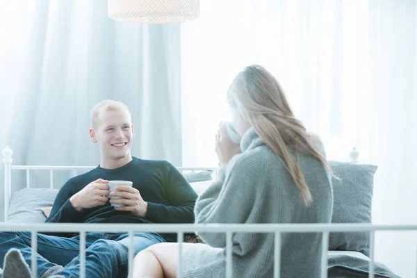 Romantic couple drinking hot drink — Stock Photo, Image