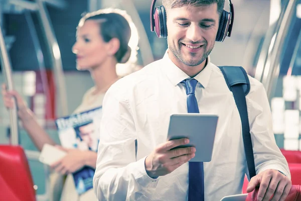 Man with headphones in train — Stock Photo, Image
