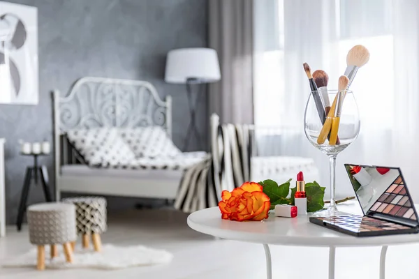 Table with makeup accessories