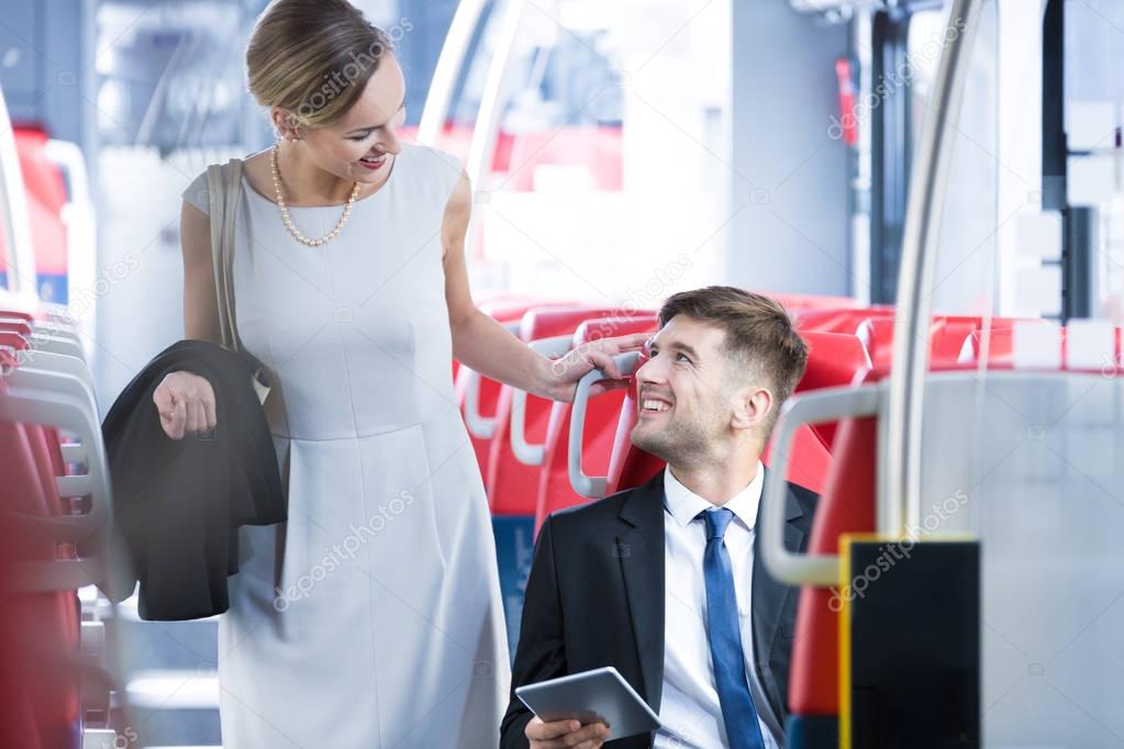 Woman meeting friend in the train