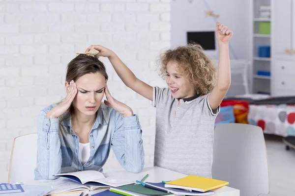 Child annoying his mother — Stock Photo, Image