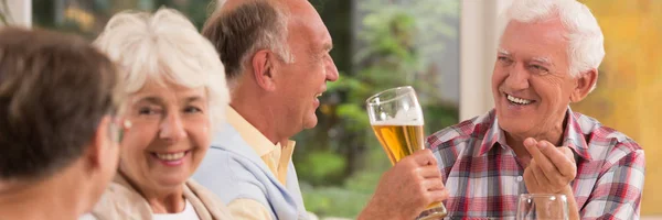 Elderly people enjoying grill party — Stock Photo, Image