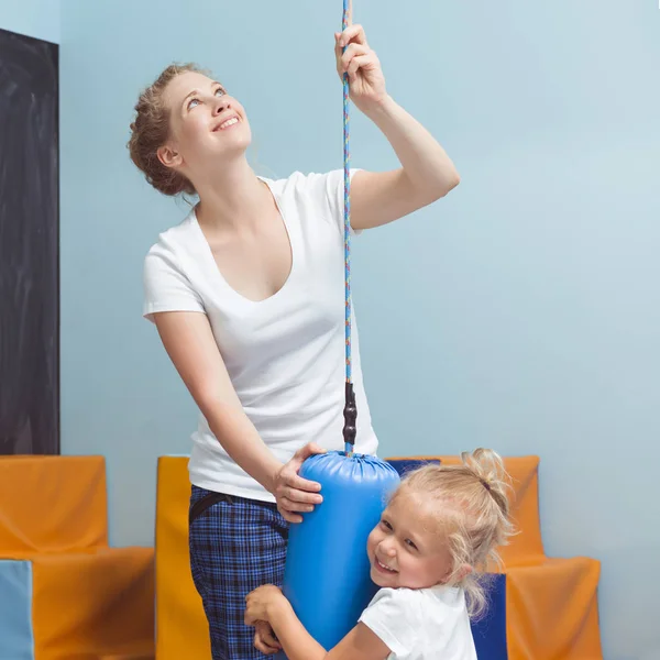 Child exercising with sensory integration equipment — Stock Photo, Image