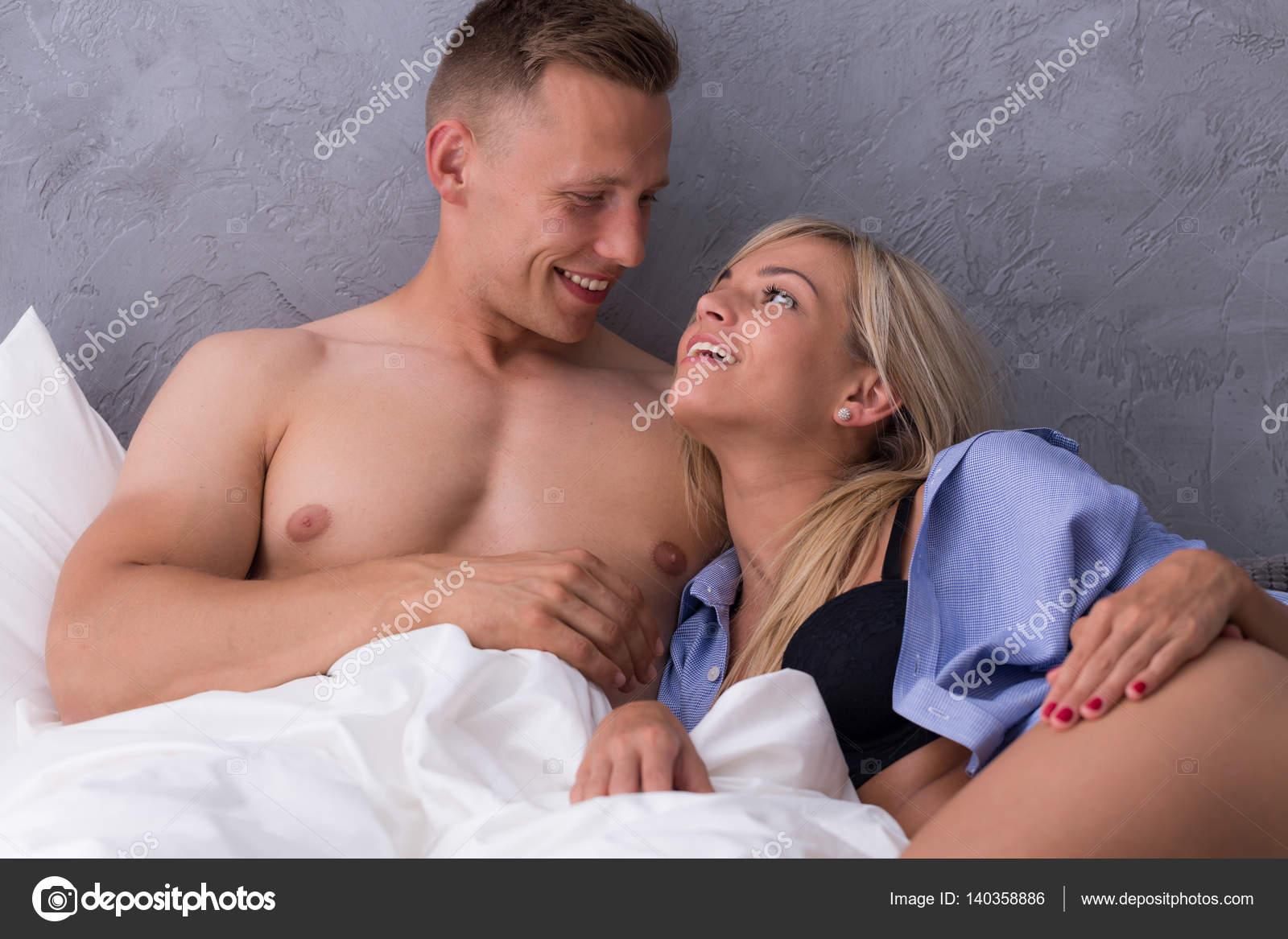 Woman laying in bed with young man Stock Photo by ©photographee.eu 140358886 photo