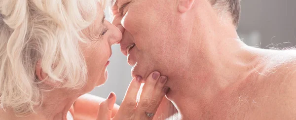 Senior couple kissing each other — Stock Photo, Image