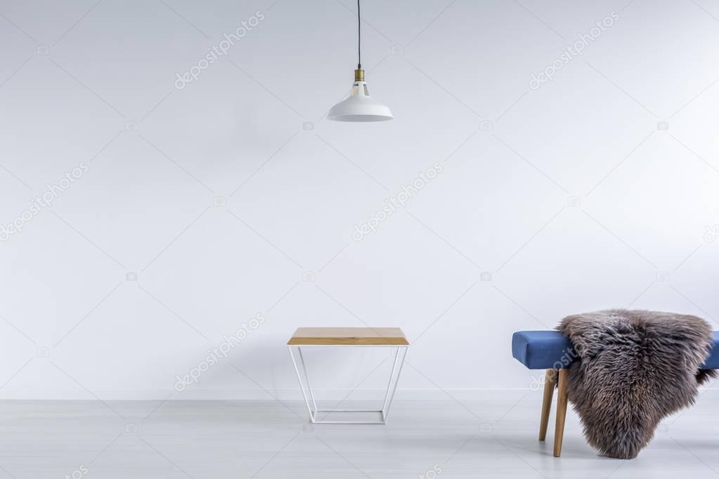 White ascetic room with bench