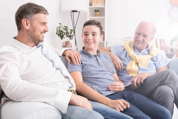 Multigenerational family on a sofa — Stock Photo, Image