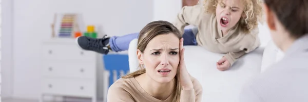 Mother talking to psychologist