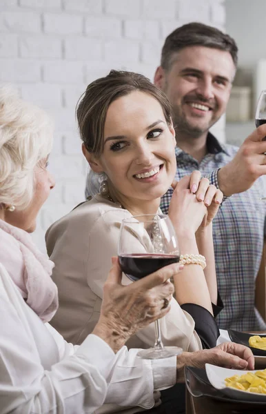 Smiling family making a toast — Stock Photo, Image