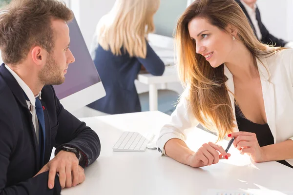Employee flirting with her boss in the office — Stock Photo, Image