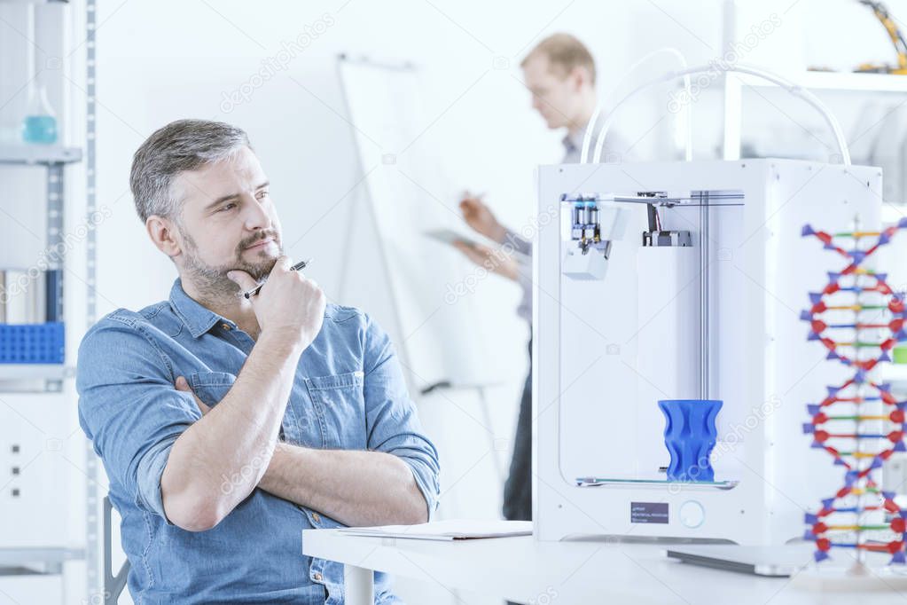 Man with 3D printer