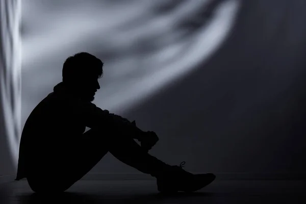 Abandoned man in dark room — Stock Photo, Image