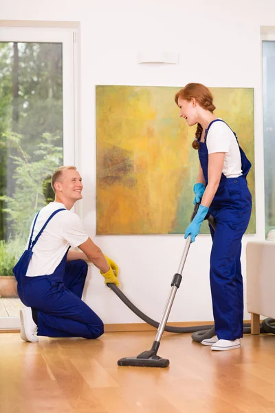 Cleaners with vacuum cleaner — Stock Photo, Image