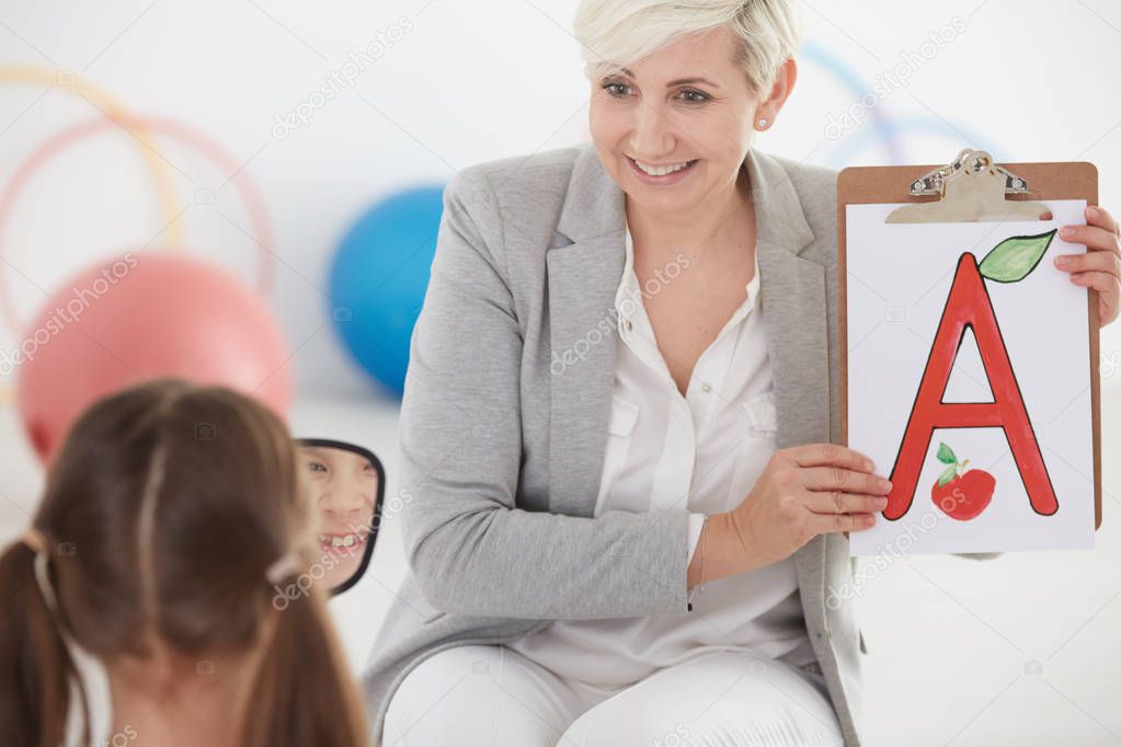 Girl during speech therapy