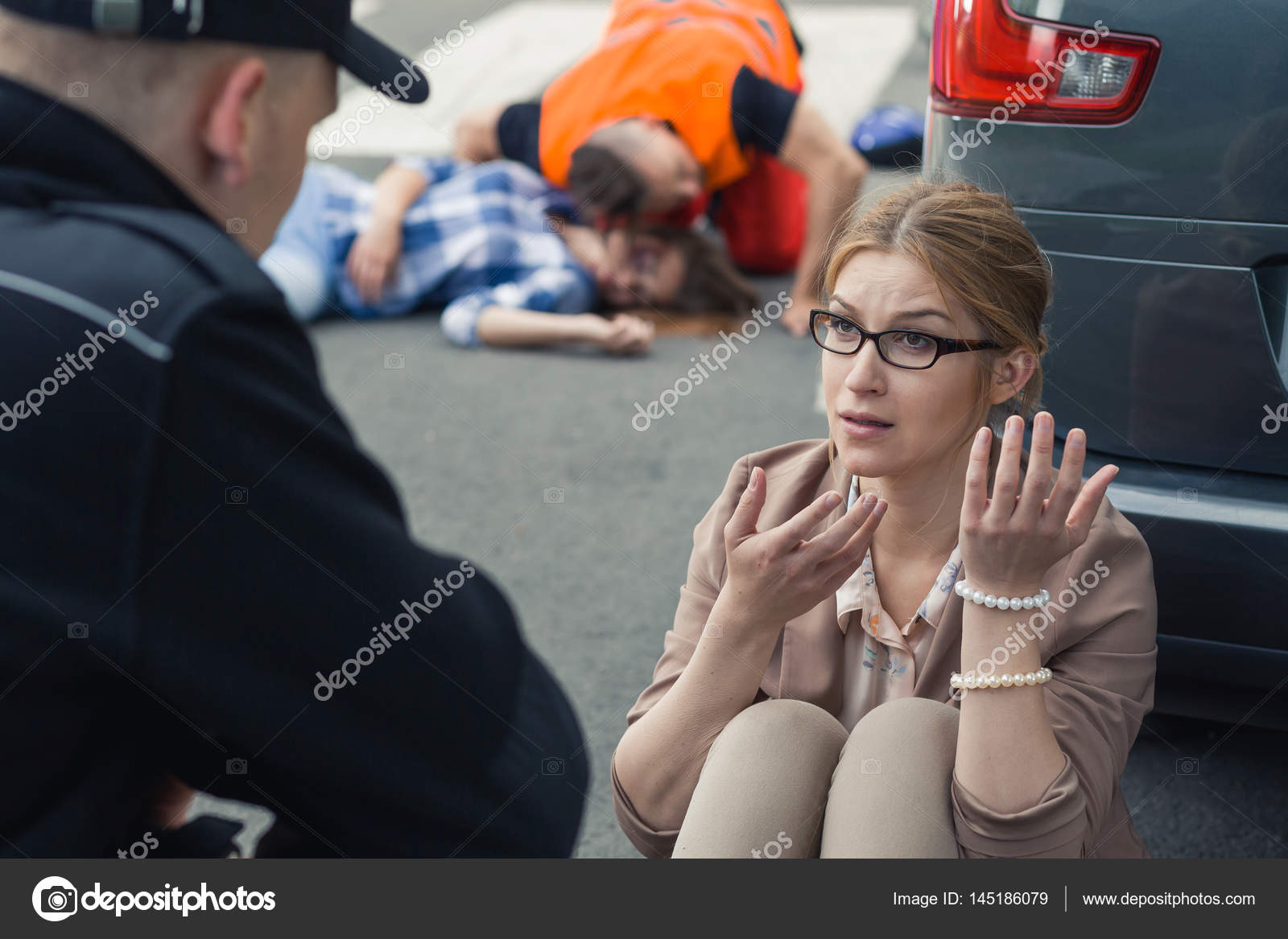 Woman traumatized after car accident Stock Photo by ©photographee.eu