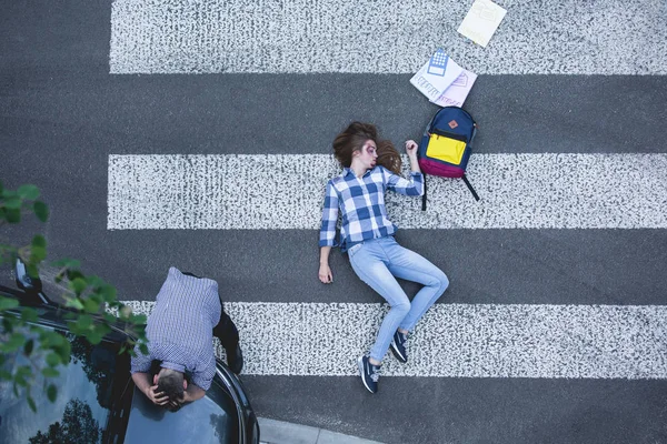 Female student hit by a car — Stock Photo, Image