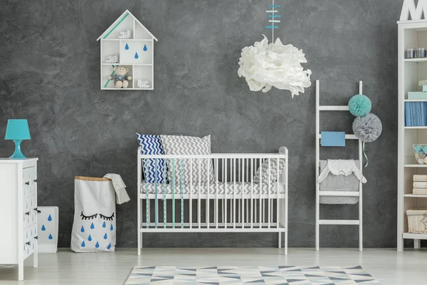 Grey baby bedroom with cot — Stock Photo, Image