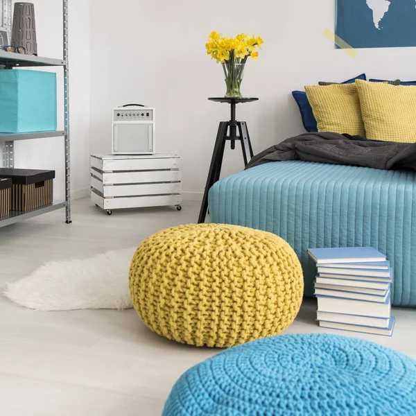 Poufs and bed in bedroom — Stock Photo, Image