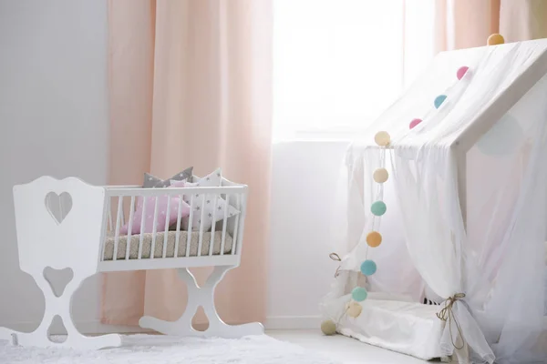 Crib and canopy playhouse in nursery — Stock Photo, Image