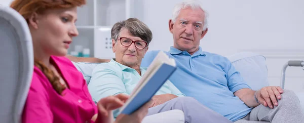 Senior citizens with a nurse — Stock Photo, Image