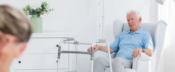 Elderly man in the armchair — Stock Photo, Image