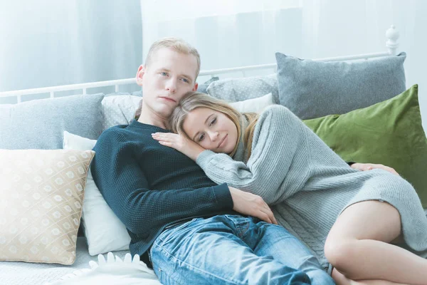 Woman and a man in a bed — Stock Photo, Image