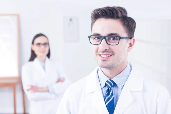 Happy optician wearing modern eyeglasses — Stock Photo, Image