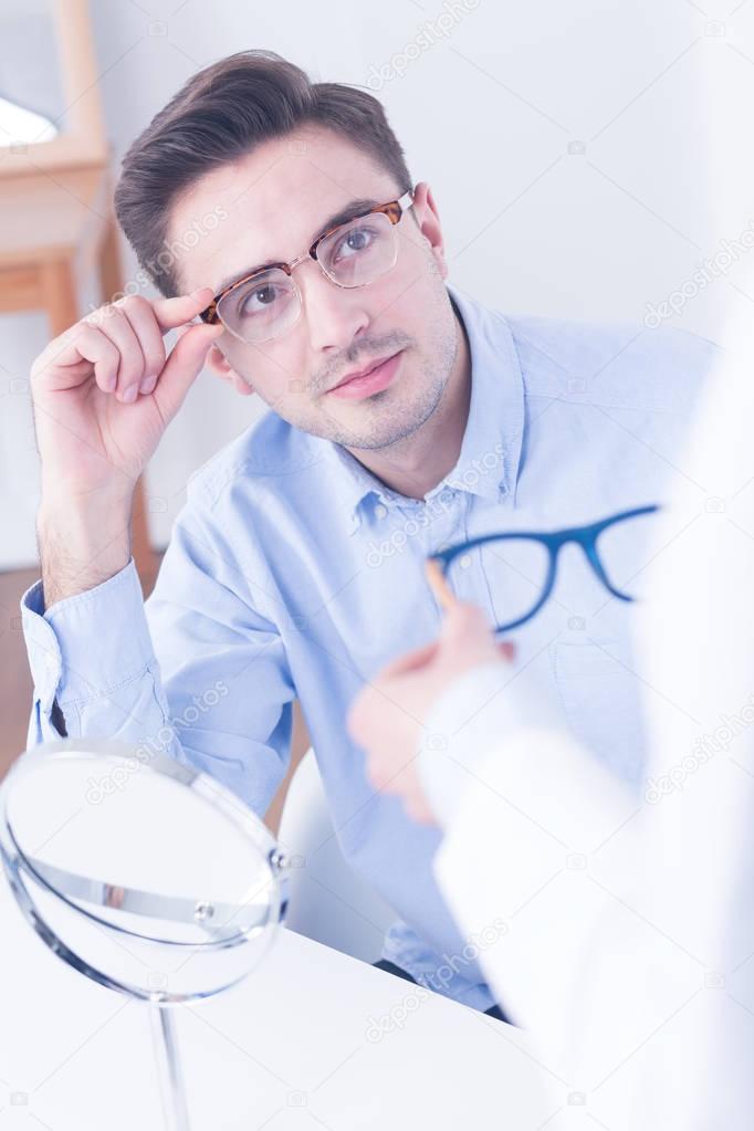 Man trying on new eyeglasses