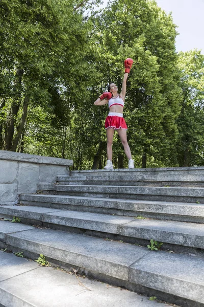 Sporty boxer woman standing in the park — Stock Photo, Image