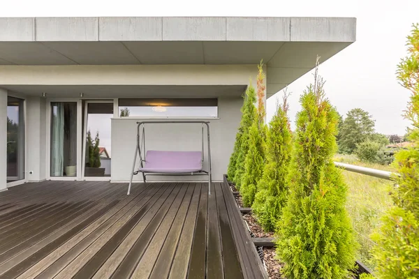 Wooden terrace with porch swing — Stock Photo, Image