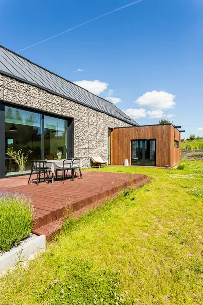 Eco-friendly backyard with wooden terrace — Stock Photo, Image