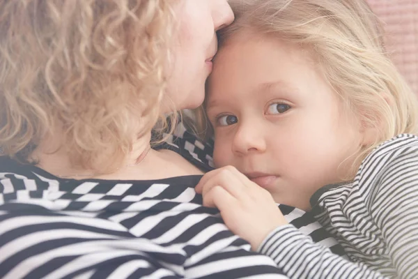 Mom kissing her daughter — Stock Photo, Image