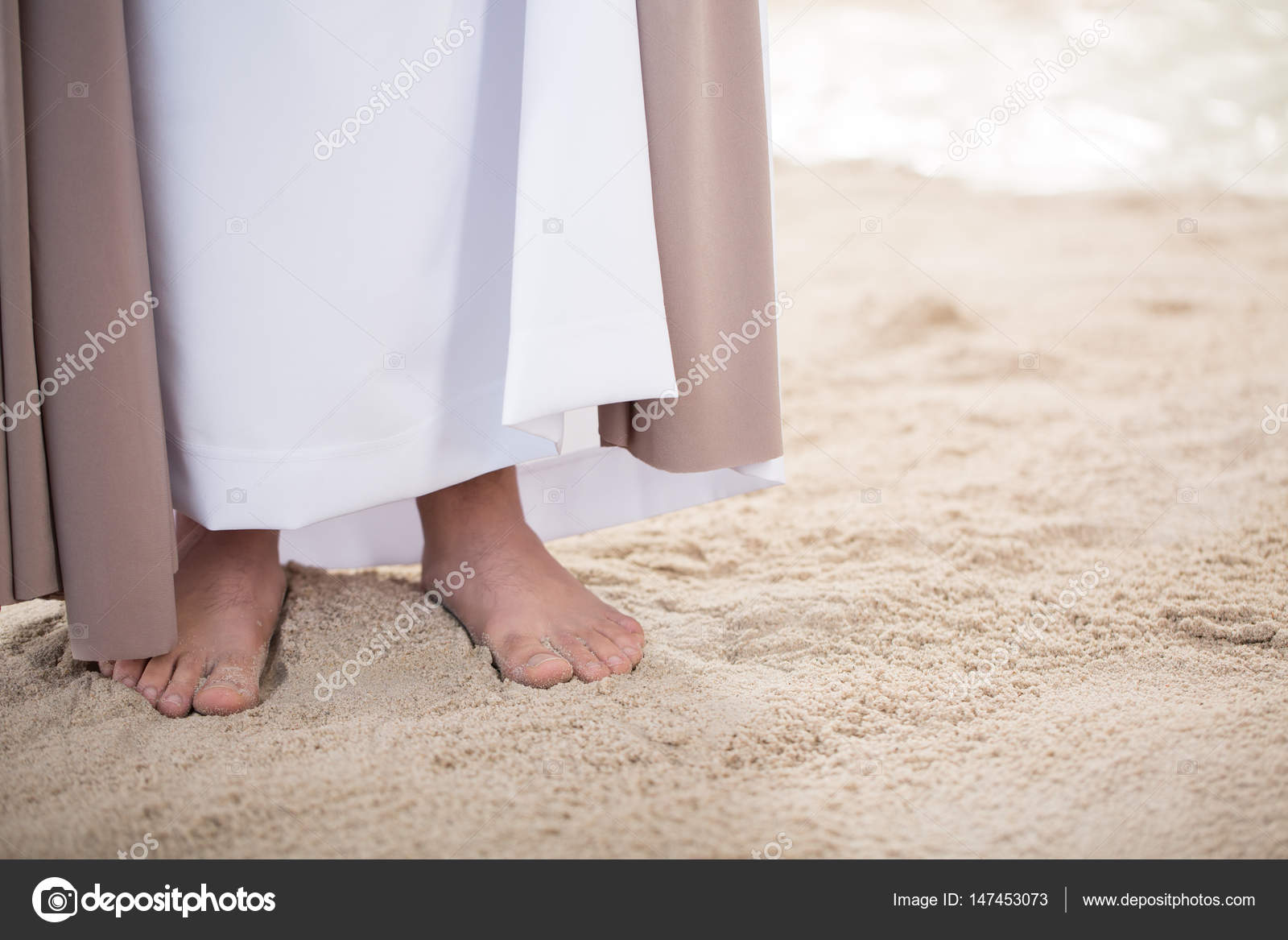 Feet of Jesus on sand — Stock Photo © photographee.eu #147453073