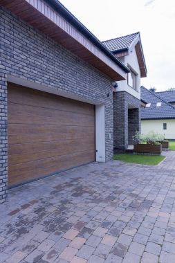 Detached house with automatic garage door clipart