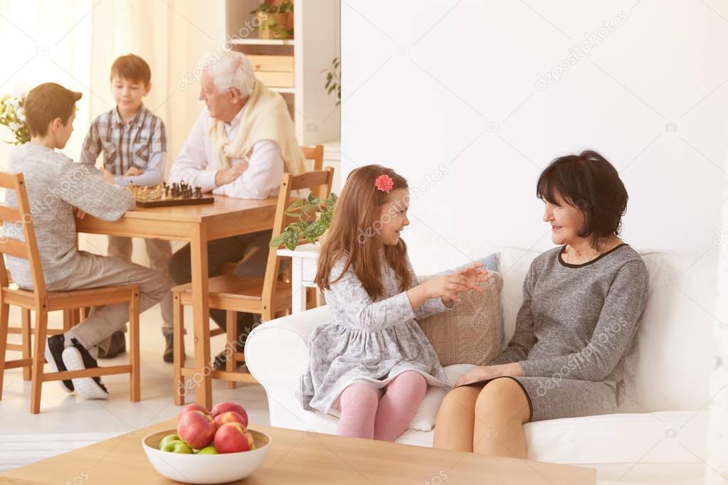 Grandma talking with granddaughter