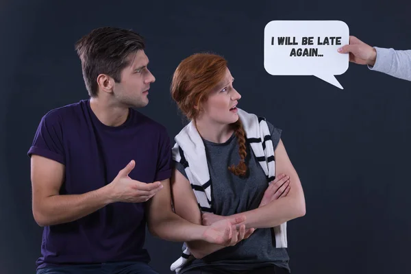 Man and woman looking at speech bubble — Stock Photo, Image
