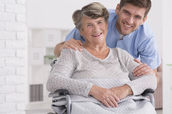 Senior care assistant with disabled woman — Stock Photo, Image