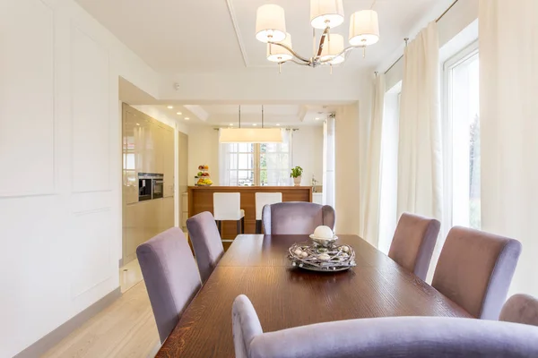 Wooden dining table in a dining area — Stock Photo, Image