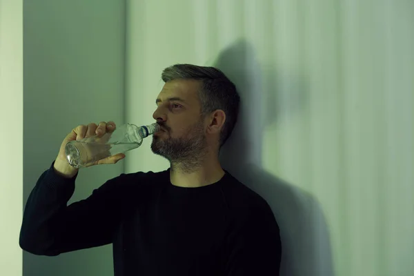 Man drinking vodka