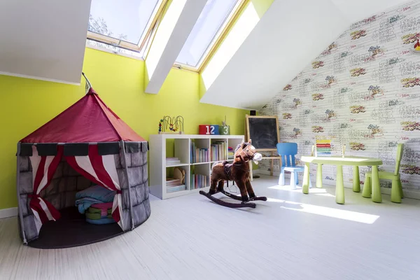 Kids room with play tent and a rocking horse — Stock Photo, Image