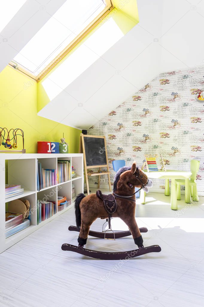 Cute kids room with a rocking horse