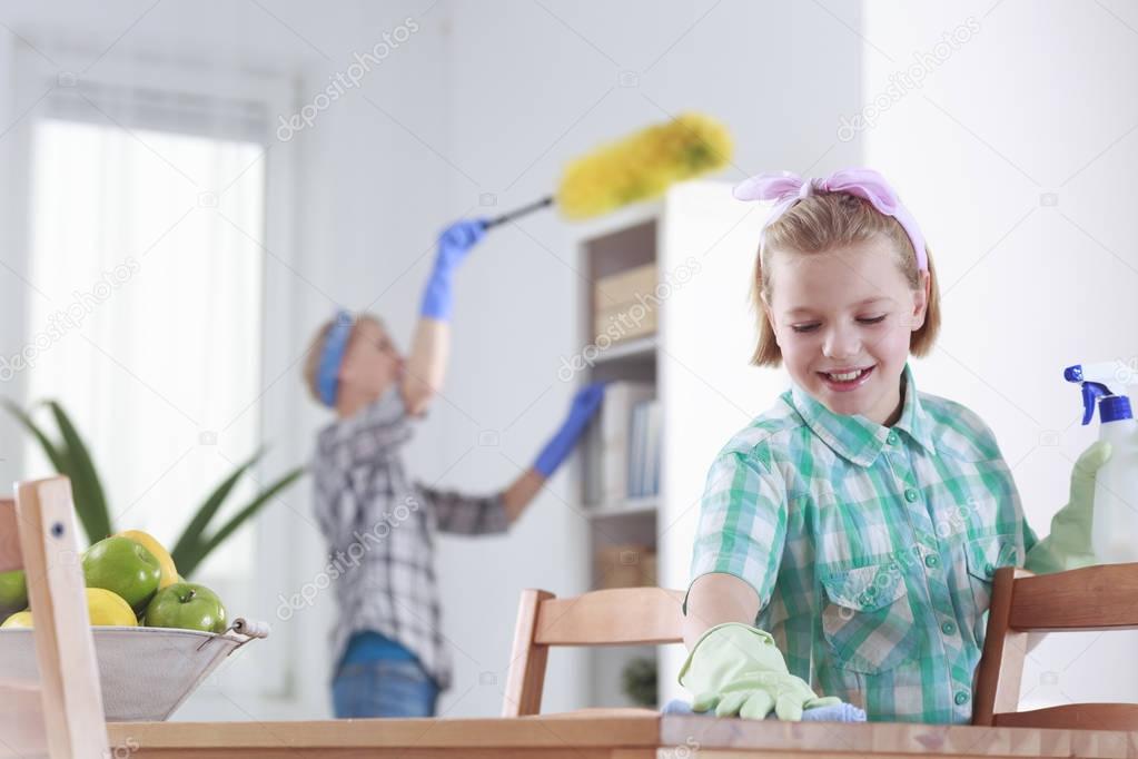 Girl cleaning at home