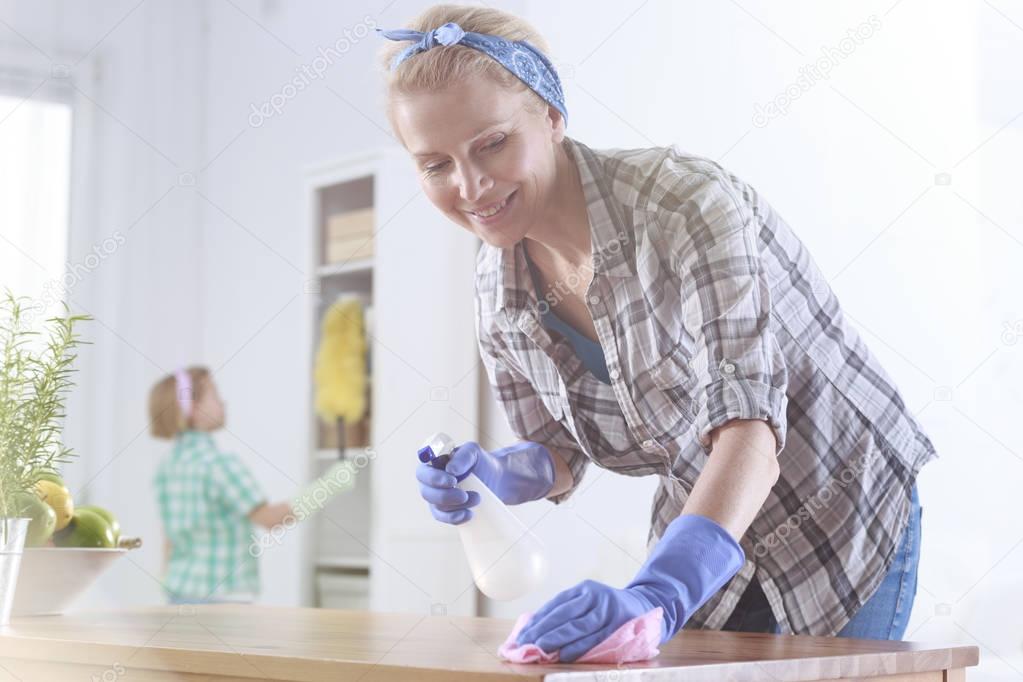 Woman wiping a table